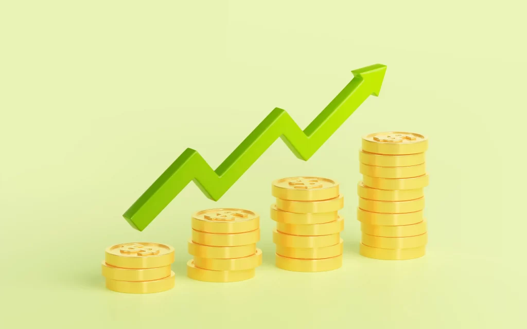 Colunas de moedas aumentando da esquerda para direita logo abaixo de um gráfico verde indicando alta