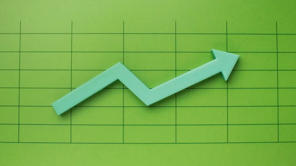 Gráfico verde de aumento com uma seta verde