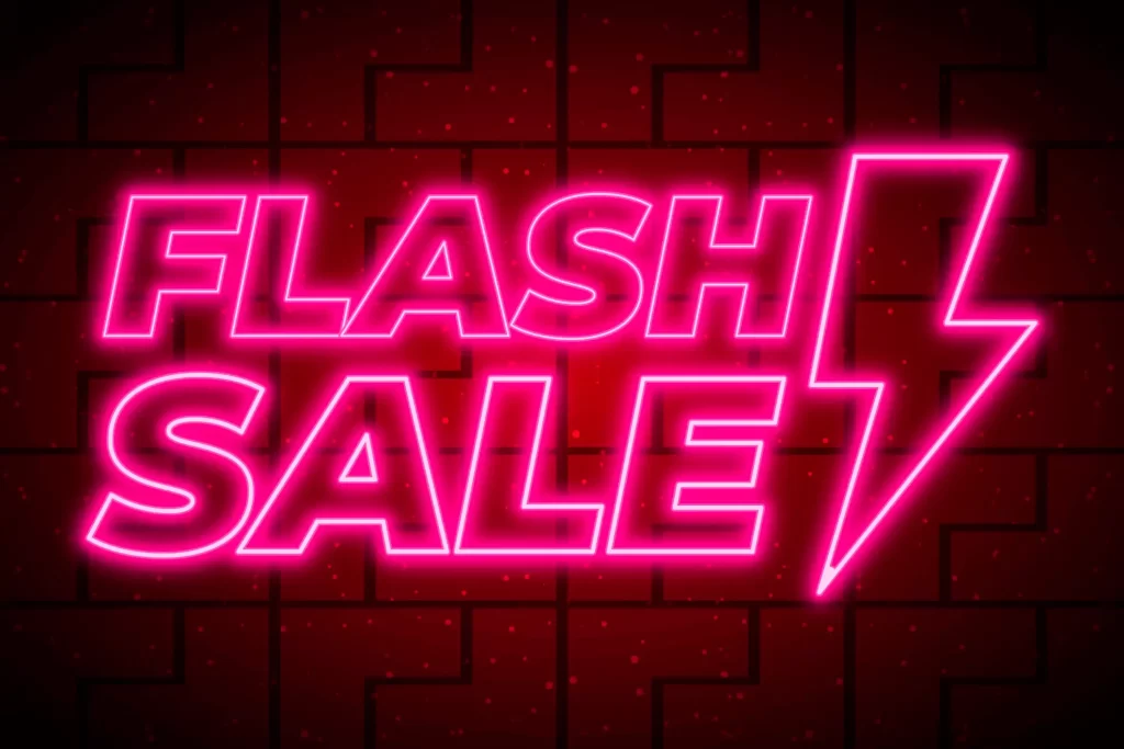 Texto em neon rosa escrito "Flash Sale" acompanhado de um raio, sobre fundo escuro com efeito luminoso