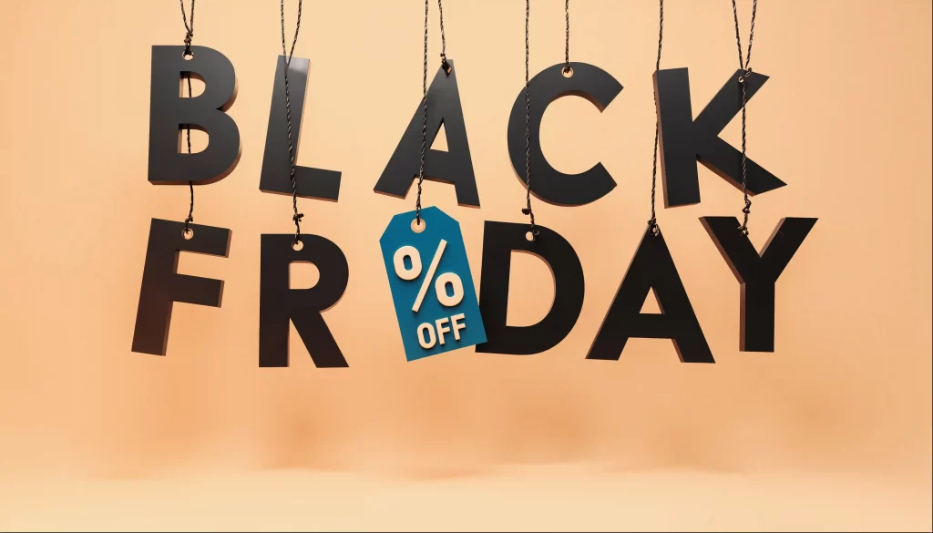 Letras penduradas formando Black Friday com uma etiqueta de desconto azul