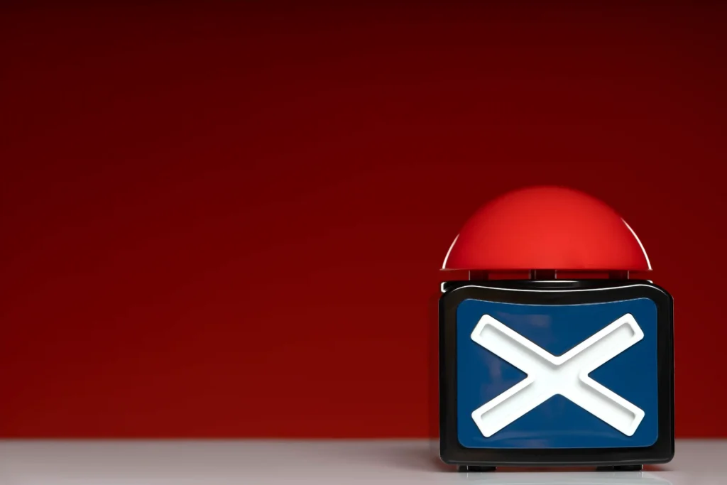 Botão vermelho de rejeição com símbolo “X” em destaque, representando erro ou reprovação em decisões de venda