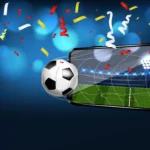 Bola de futebol saindo da tela de smartphone com confetes coloridos, ilustrando as oportunidades de vendas online na Copa do Mundo 2026