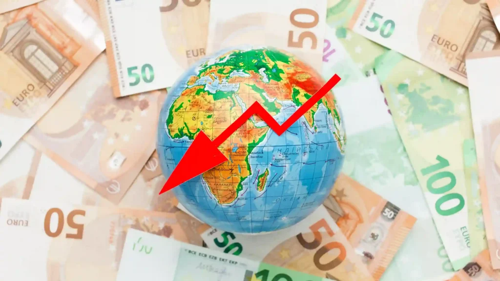 Globo sobre notas de dinheiro com seta vermelha apontando para baixo, representando redução da taxa das blusinhas