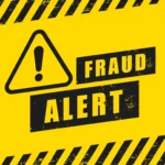 Placa amarela de alerta de fraude com símbolo de atenção e a mensagem “Fraud Alert”