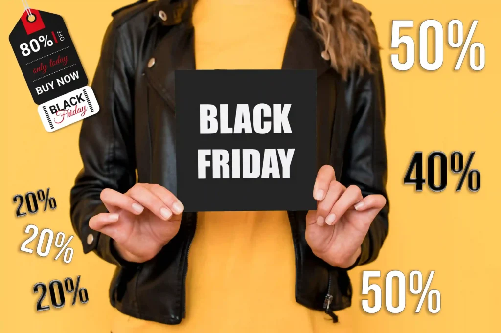 Pessoa segurando placa de Black Friday cercada por percentuais de desconto de 20%, 40%, 50% e 80%, representando a definição de preços Black Friday e promoções